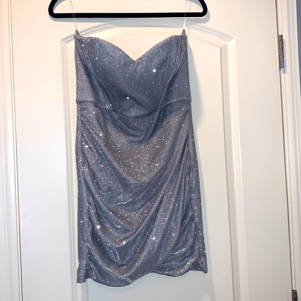 Very short dress, slit in the front, very sparkly as well.
